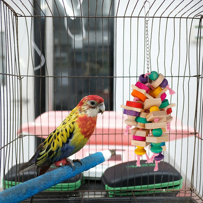 House of parrots & aviaries wooden block and knot hanging chew toy for a colorful parrot inside a wire cage
